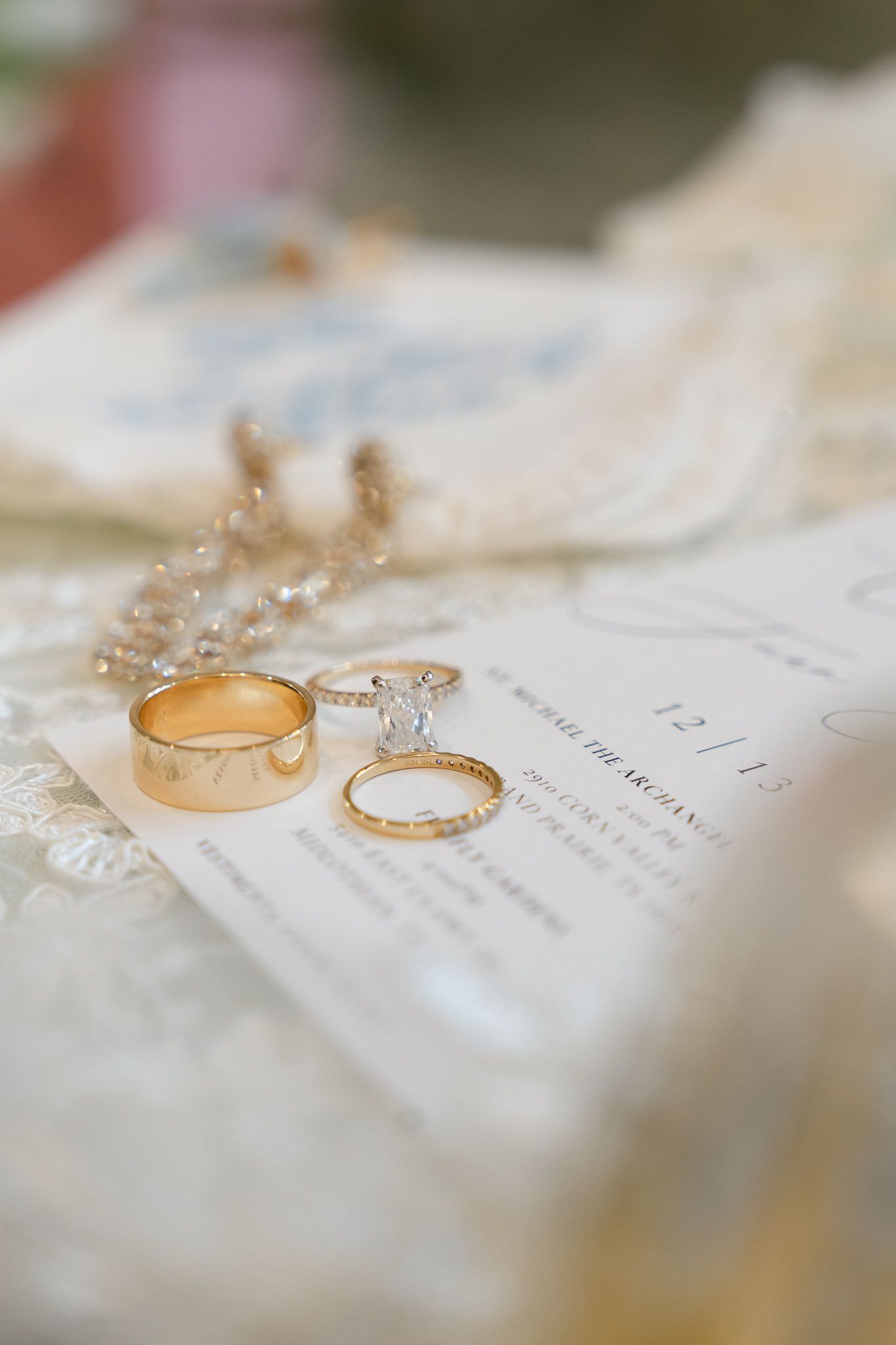 Luxury wedding flat lay with invitations, rings, and florals in Dallas-Fort Worth