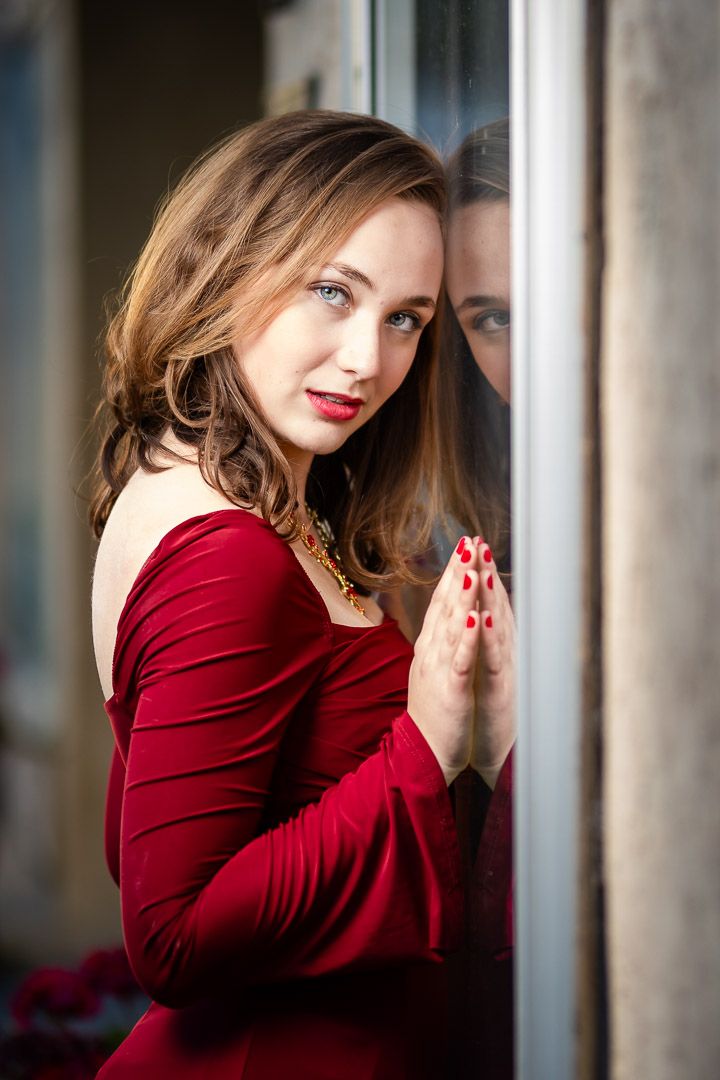 High school senior girl in a red dress during a senior session in Harrison, Arkansas