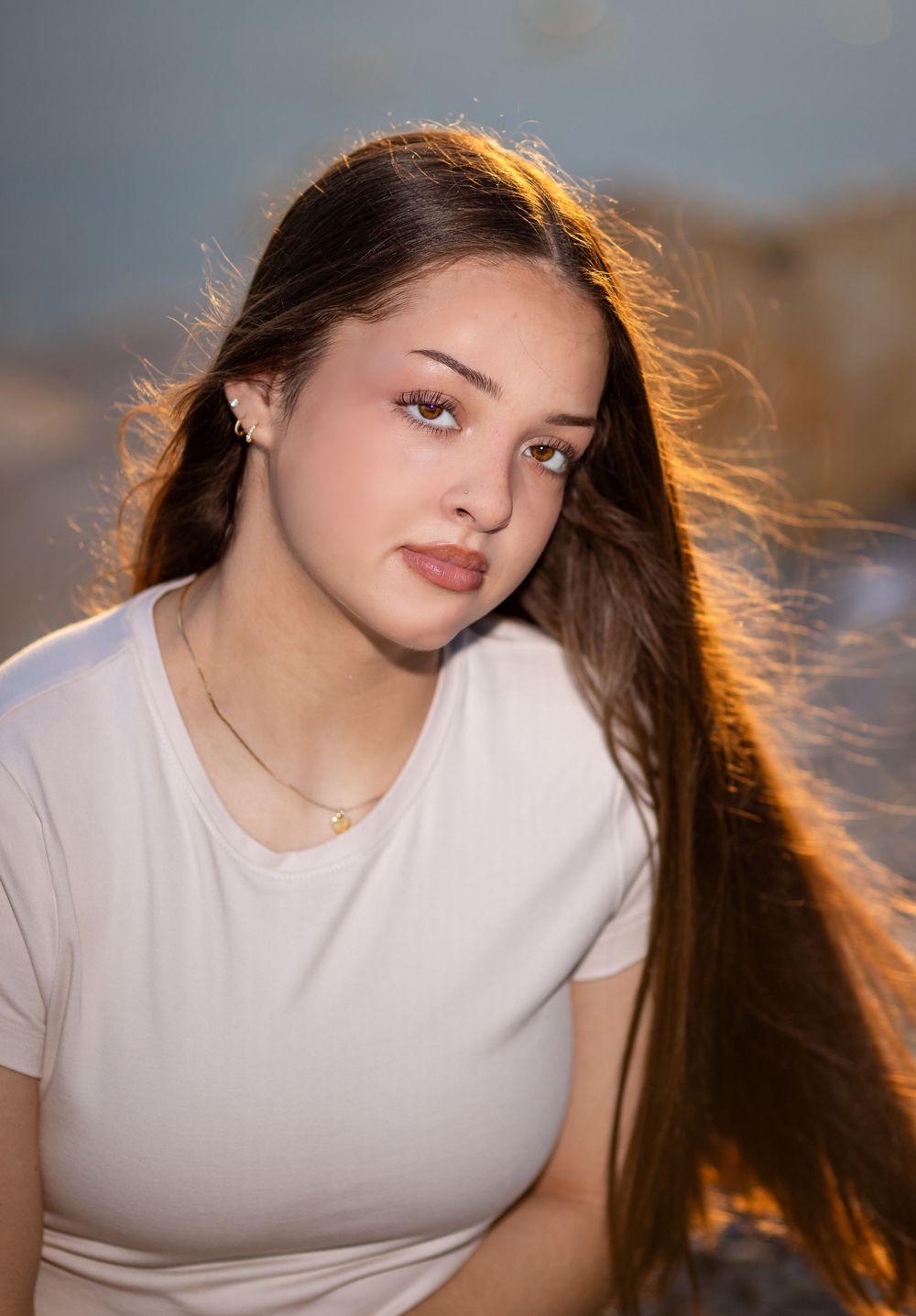 High school senior girl at golden hour during an outdoor senior session in Mountain Home, Arkansas