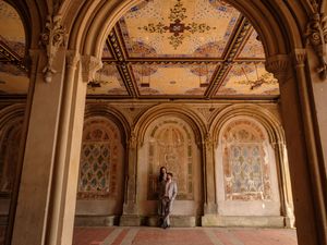 Ornate golden ceiling and arches in a luxurious palace interior with intricate architectural details and frescoes.