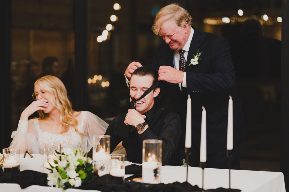A candid moment of laughter during the wedding reception dinner.