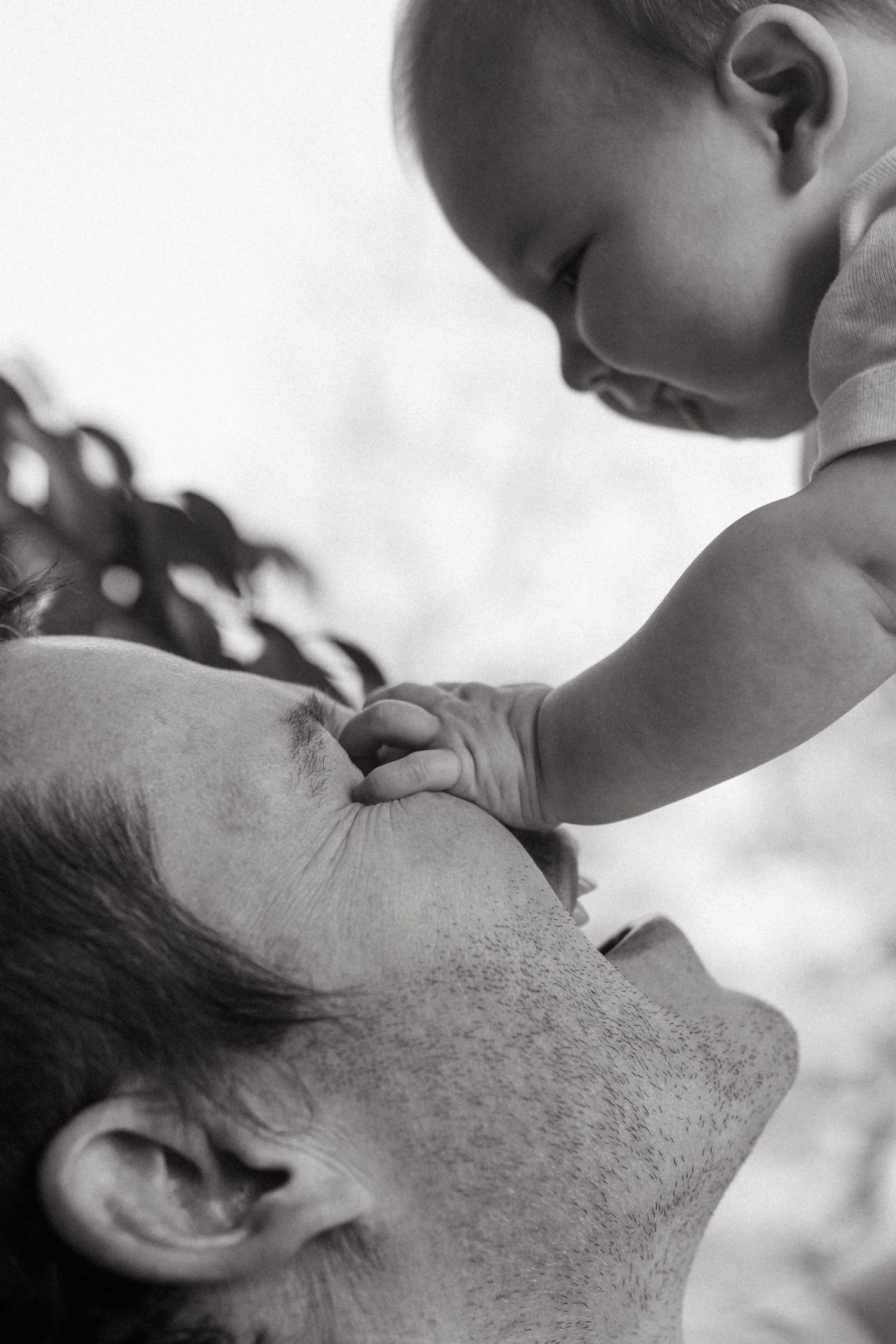 Black and white profile shots capturing tender family moments.
