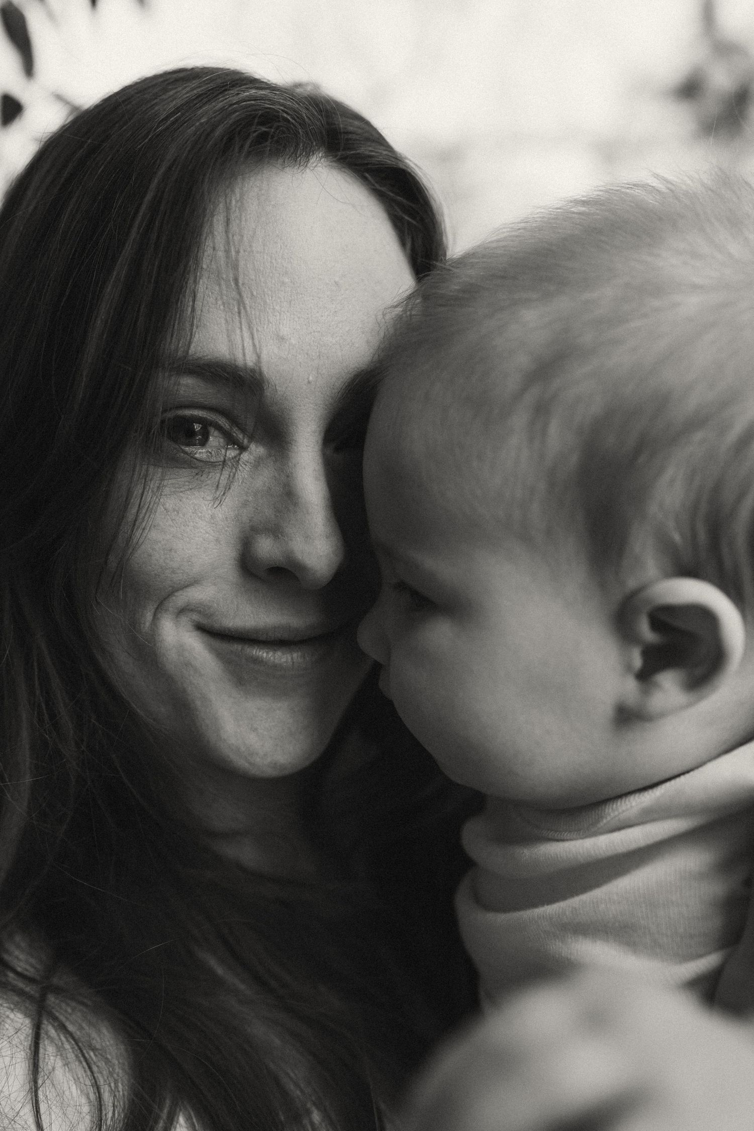 Close-up series showing loving interaction between parent and baby.