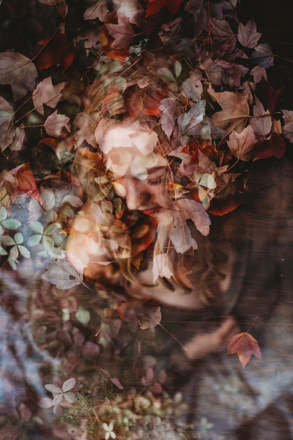 Double exposure portrait blending with autumn leaves and flowers in dreamy tones. Bellevue studio, WA