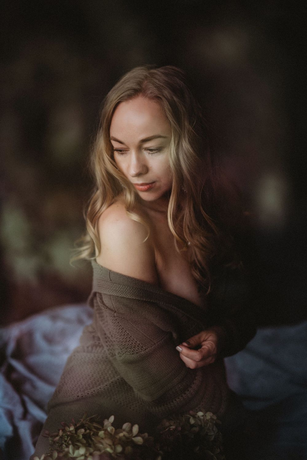 Moody boudoir photograph with soft lighting and earth tones. Bellevue studio, WA