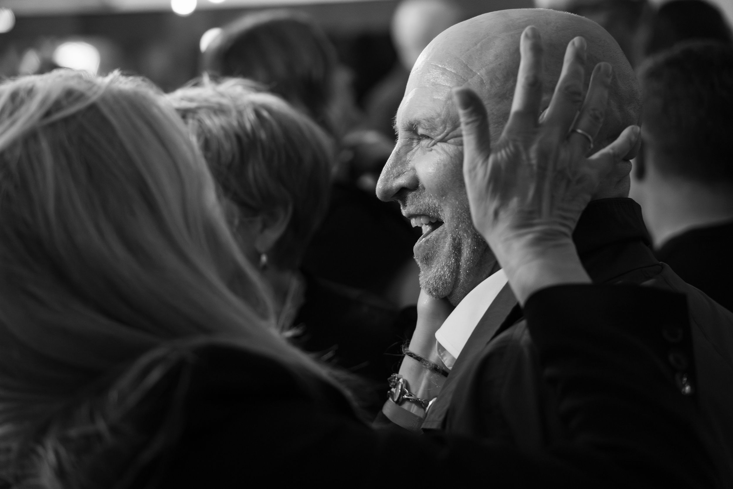 Black and white candid shots of party guests socializing at an evening event.