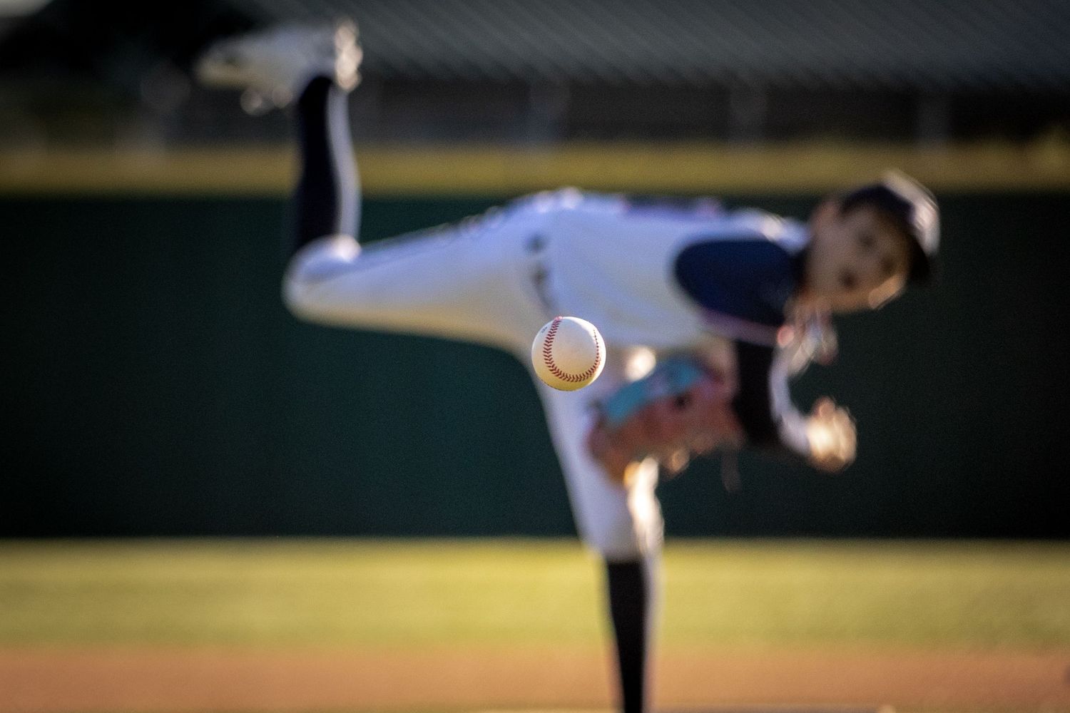 Drew Arnold Photography Youth baseball pitching photo with the ball in focus