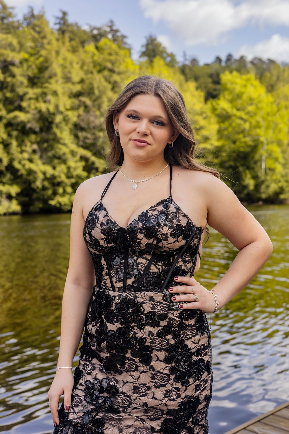 prom photo, girl on lake in a black dress