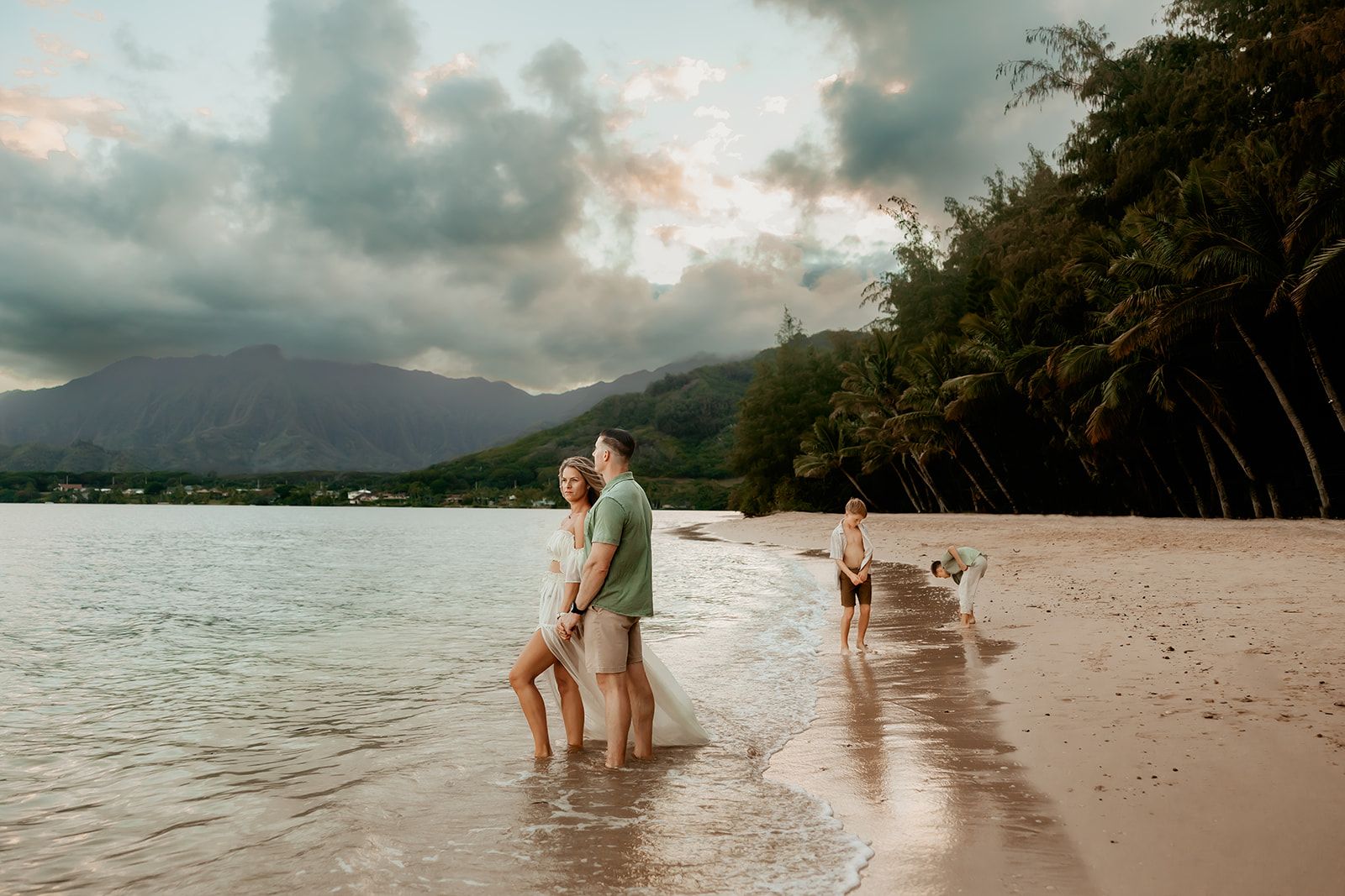 Oahu Family Photographer captures a family at sunset in Hawaii.