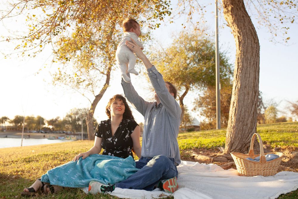 Newborn family photo shoot cinematic picnic blanket baby image Phoenix, Arizona