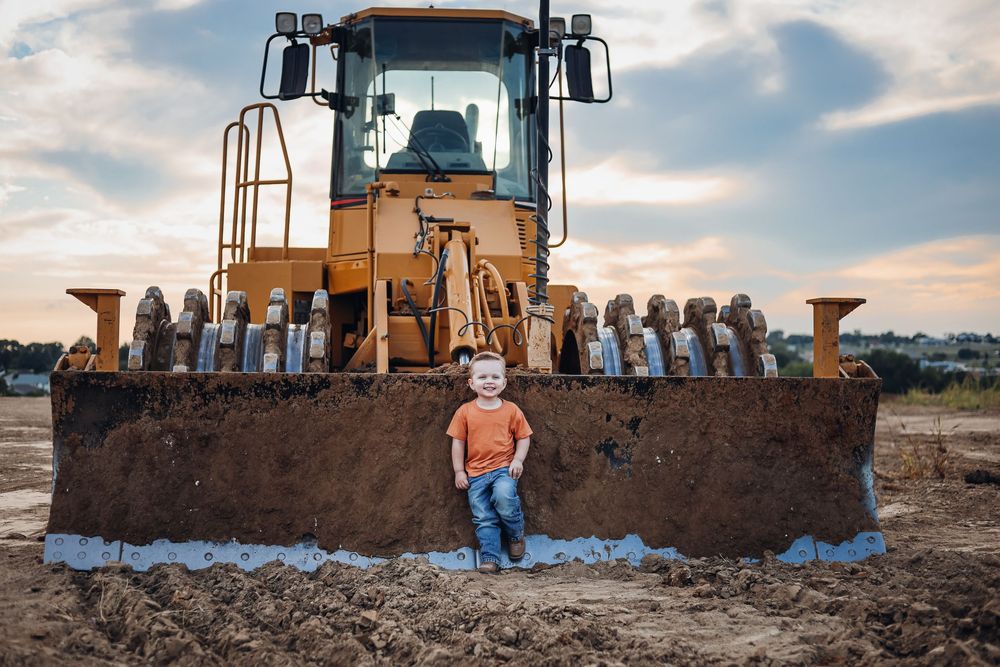 Line of heavy construction machinery against cloudy sky. Milestone photography