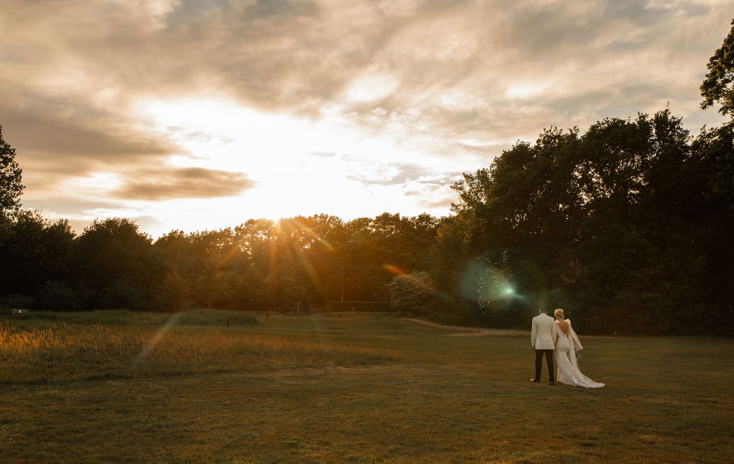 Wedding ceremony moment inside a rustic venue with natural lighting.