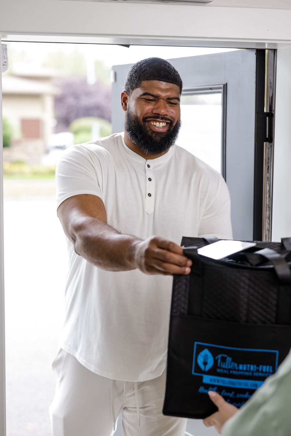 Fuller Nutri Fuel Seattle, WA Meal Prep delivery service for the busy professional product man of color delivering prepared meals to home