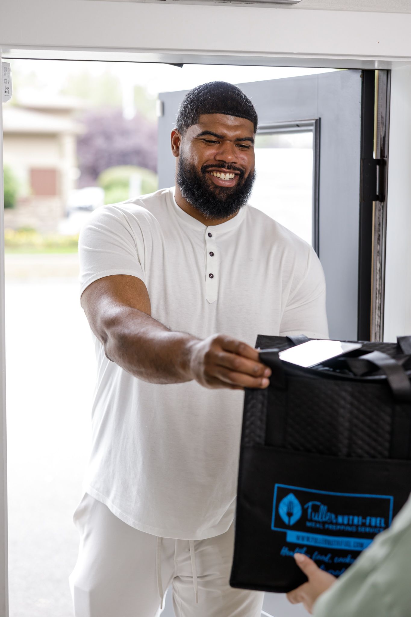 Fuller Nutri Fuel Seattle, WA Meal Prep delivery service for the busy professional product man of color delivering prepared meals to home
