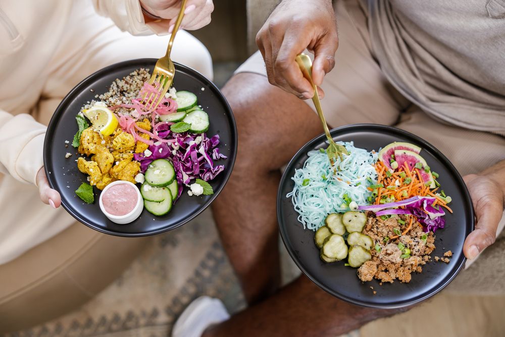 Fuller Nutri Fuel Seattle, WA Meal Prep delivery service for the busy professional product 2 partners sitting eating plate of food