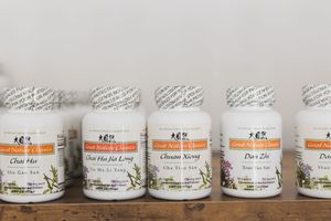 Maple Valley, WA Acupuncture shelf of recommended supplements for clients lifestyle product herb containers on shelf