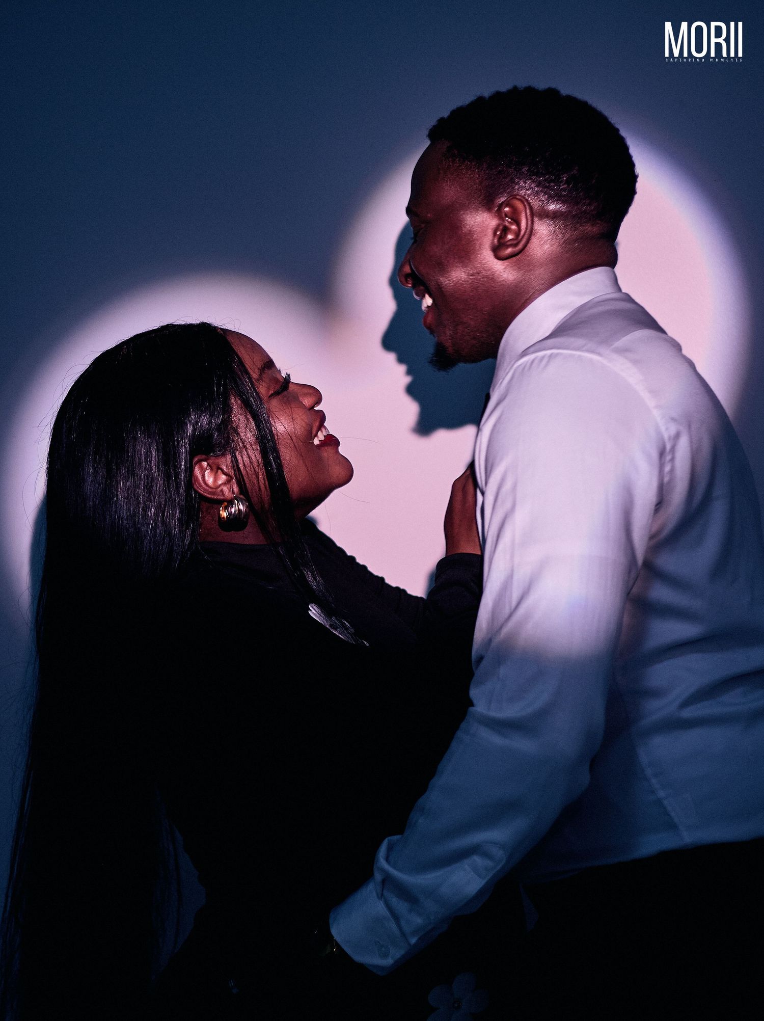 a couple embracing with the heart light shinning on them