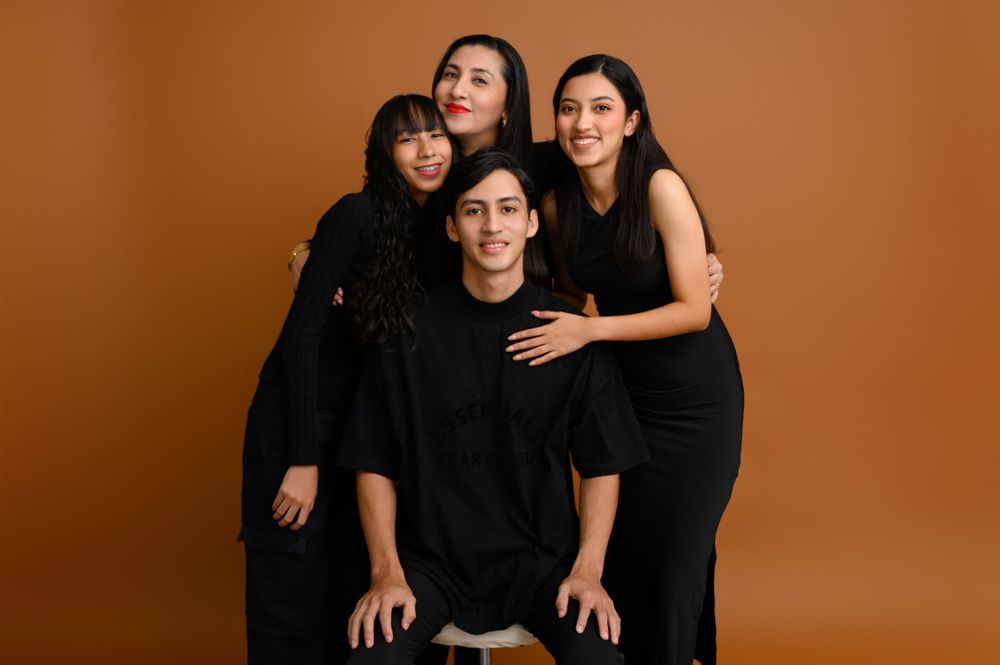 Family portrait series against warm brown backdrop showing playful interactions and smiles.