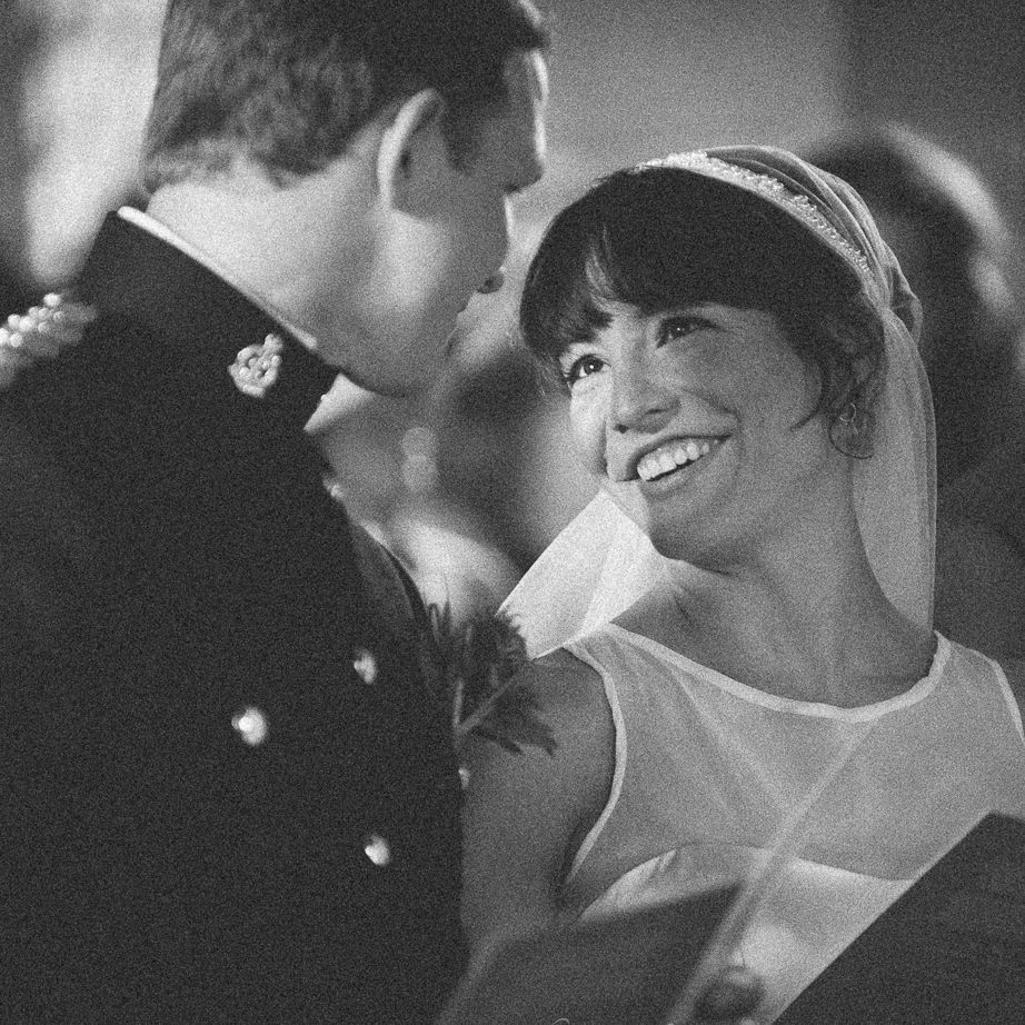 Reportage detail shot of bride smiling at her new husband