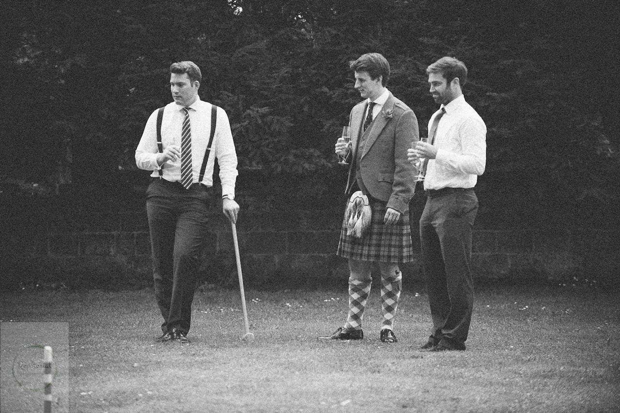 Reportage detail shot of guests enjoying croquet during the wedding reception