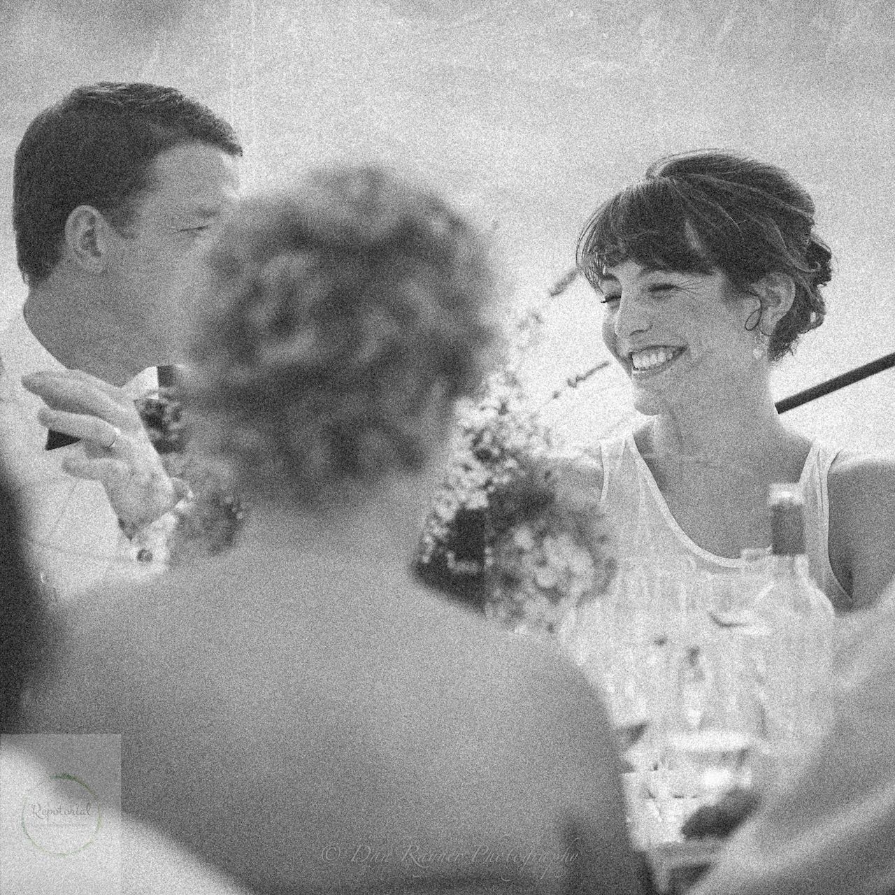 Wedding reportage photo of bride smiling during the wedding breakfast best mans speech