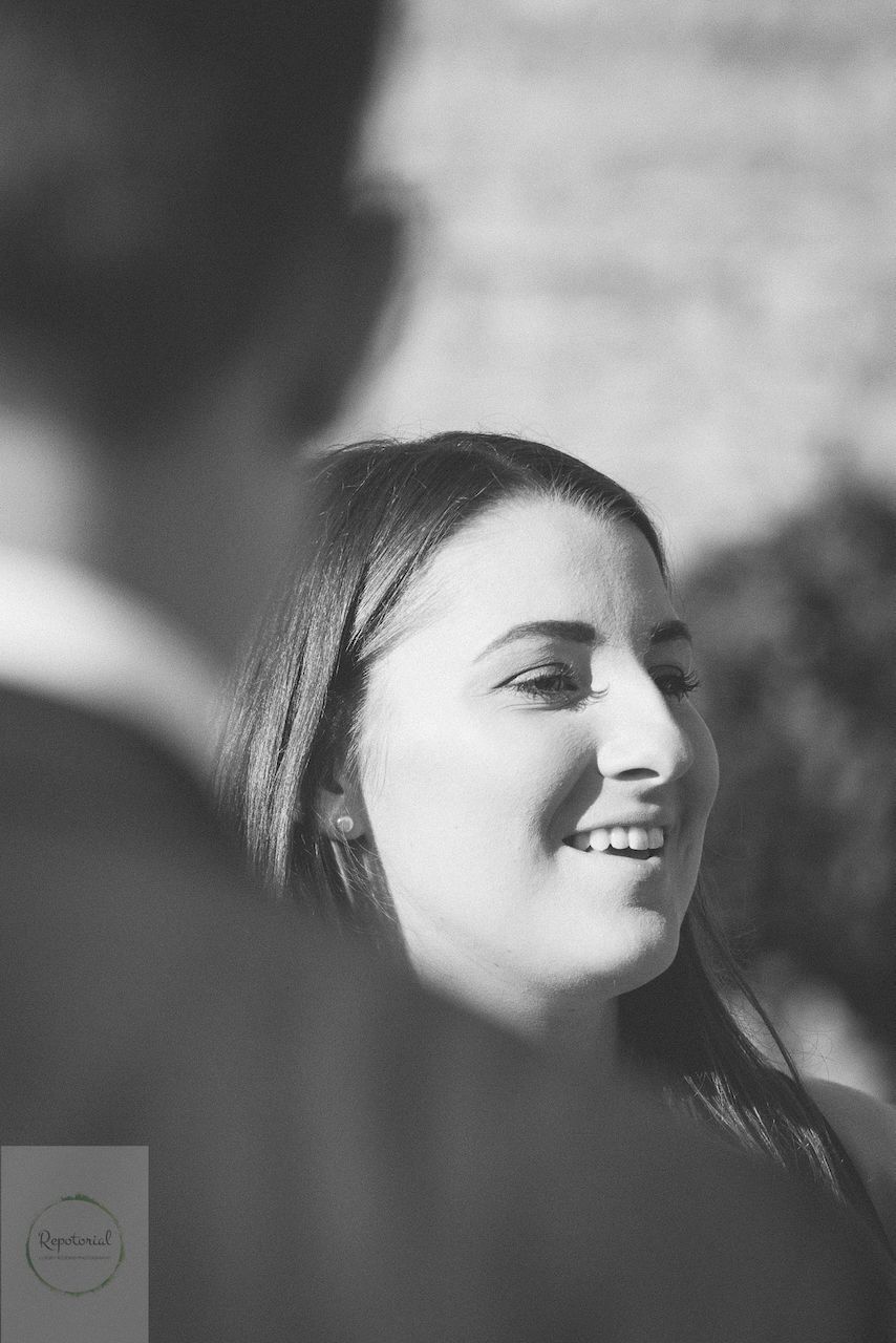 Guests enjoying the wedding reception captured in candid style. Stratton Court Barn