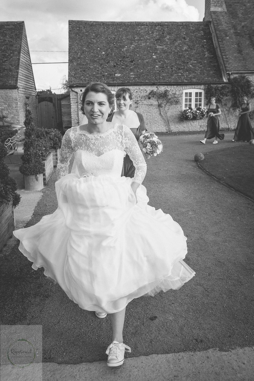Reportage detail shot of bride running to the ceremony