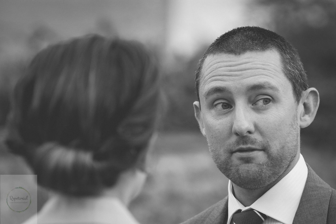 Guests enjoying the wedding reception captured in candid style. Stratton Court Barn