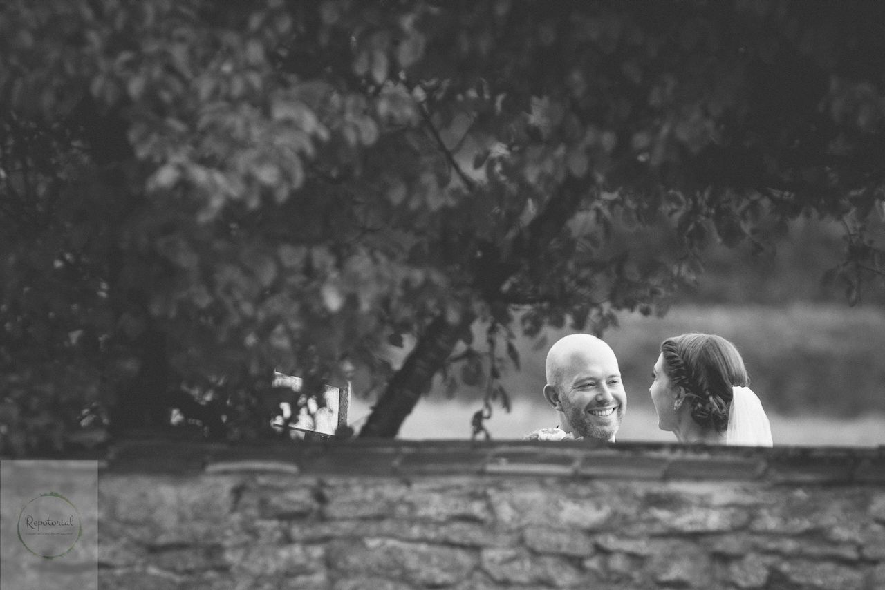 Guests enjoying the wedding reception captured in candid style. Stratton Court Barn