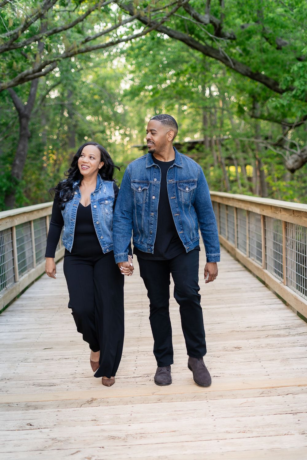 A couple walking a wooded path