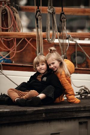 Lifestyle children’s portrait in natural light Siblings sharing a playful moment together