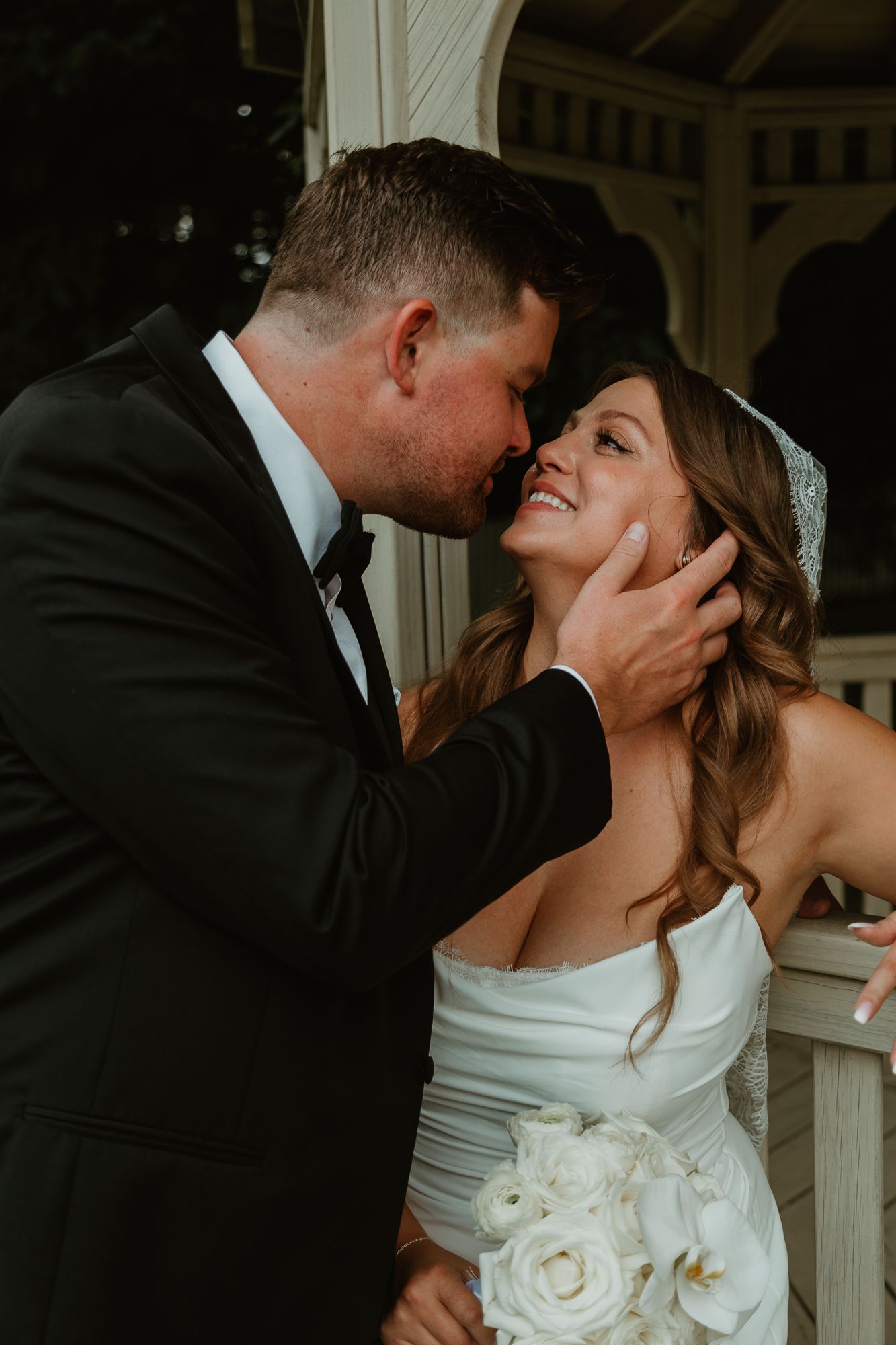 A romantic sequence of wedding photos showing a couple sharing tender kisses in formal attire against an elegant backdrop.
