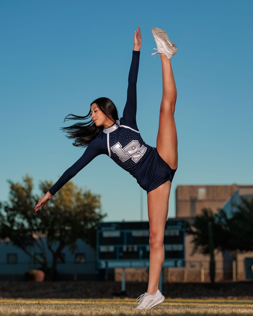 Ironwood Ridge Pomline dancer posing on Football field Tucson, AZ