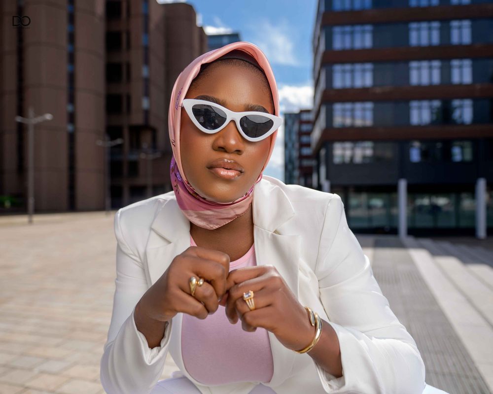 Urban portrait with modern building architecture and blue sky in the background.