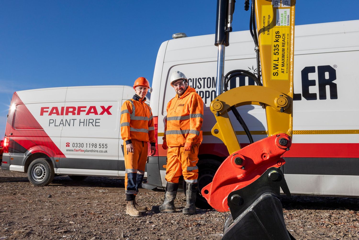 Construction workers in orange safety gear standing next to equipment and Fairfax branded van.