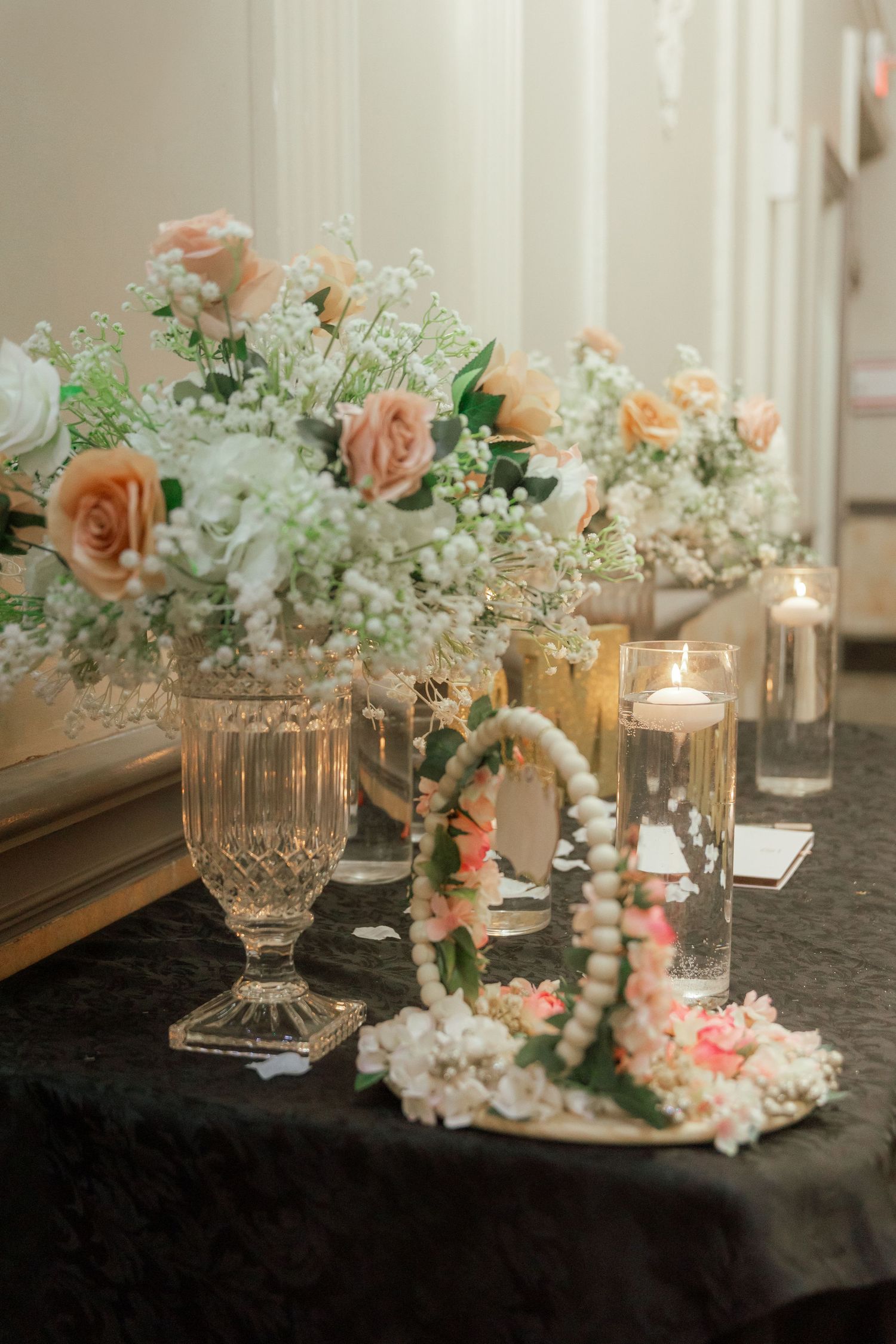 Bride and groom sharing a joyful moment on their wedding day, surrounded by elegant decor and loved ones.