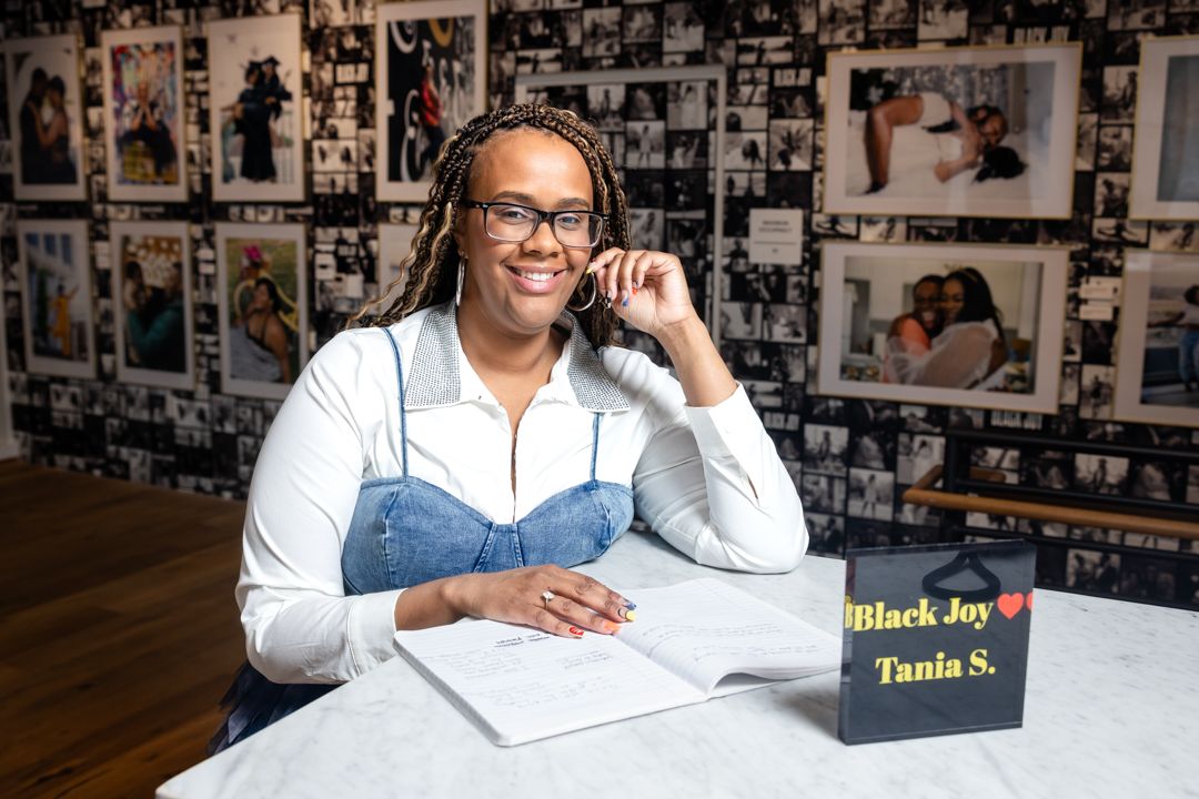 Photographer TaNia S in her Black Joy exhibition in Washington DC Arena Social Arts Club Drew Gallery