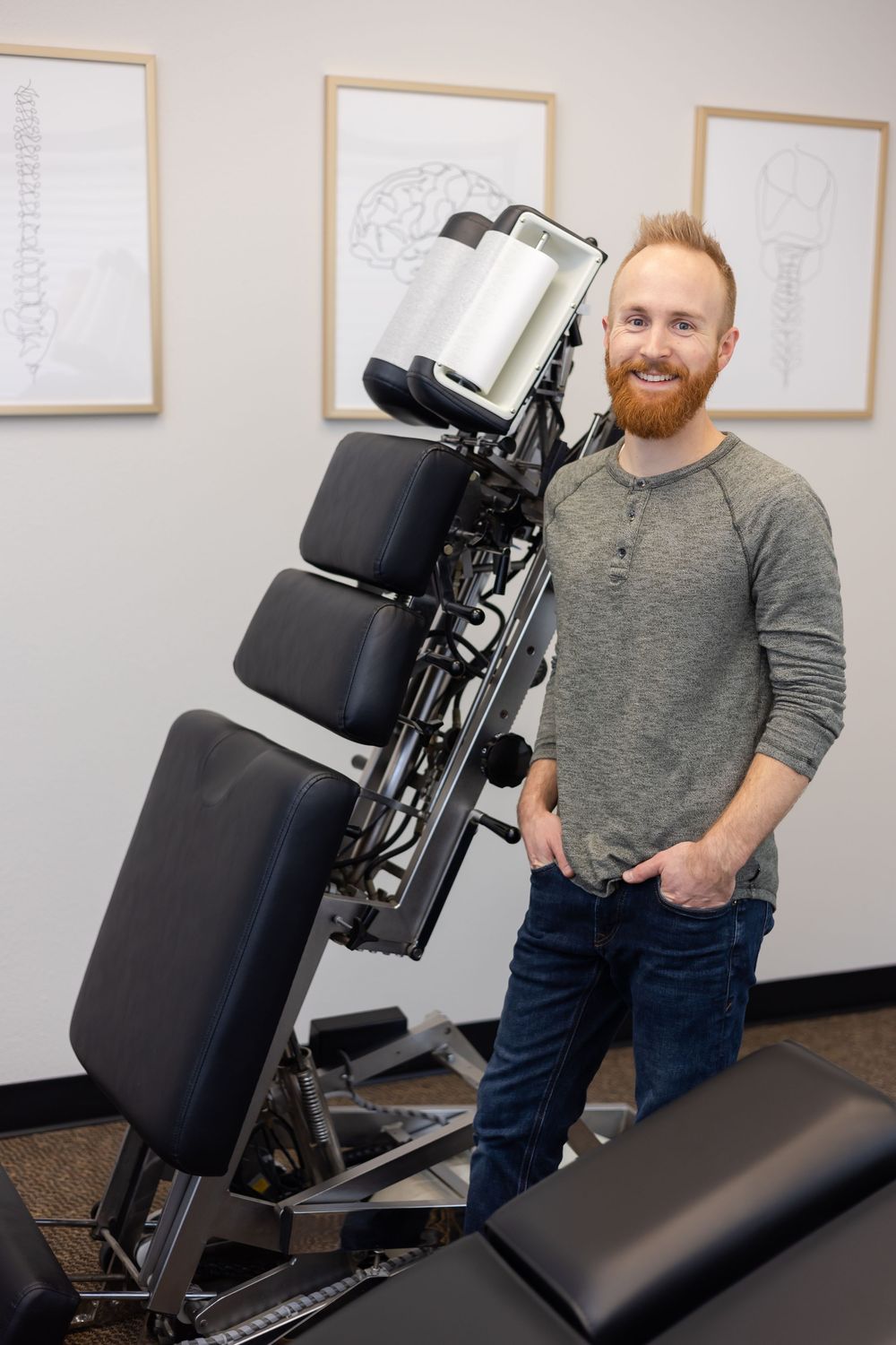 Limitless chiropractic in Sumner WA, man standing in adjustment room for lifestyle headshot