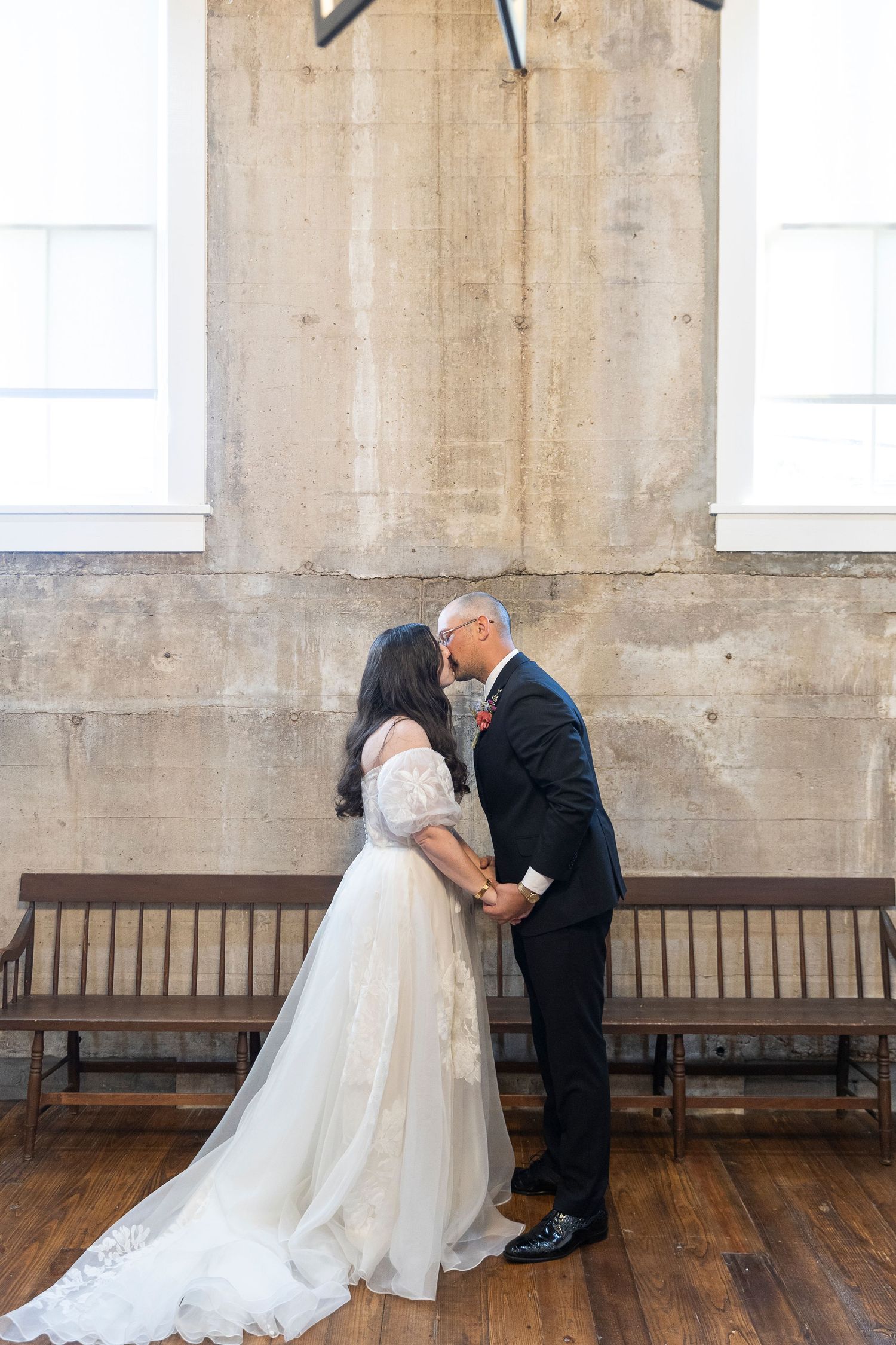 Wedding first look sequence showing emotional moment between couple in rustic venue.