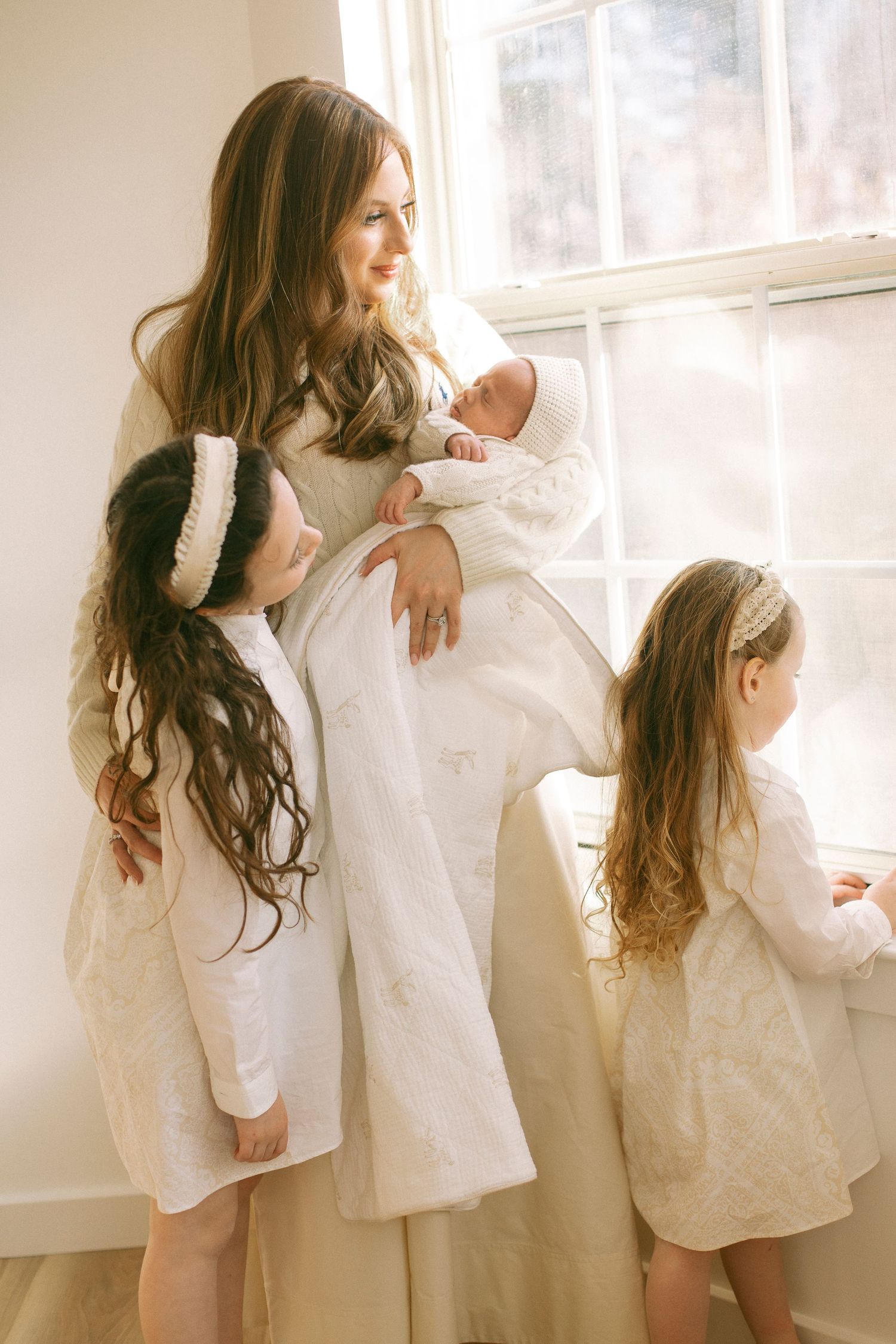 mother holding newborn to  chest