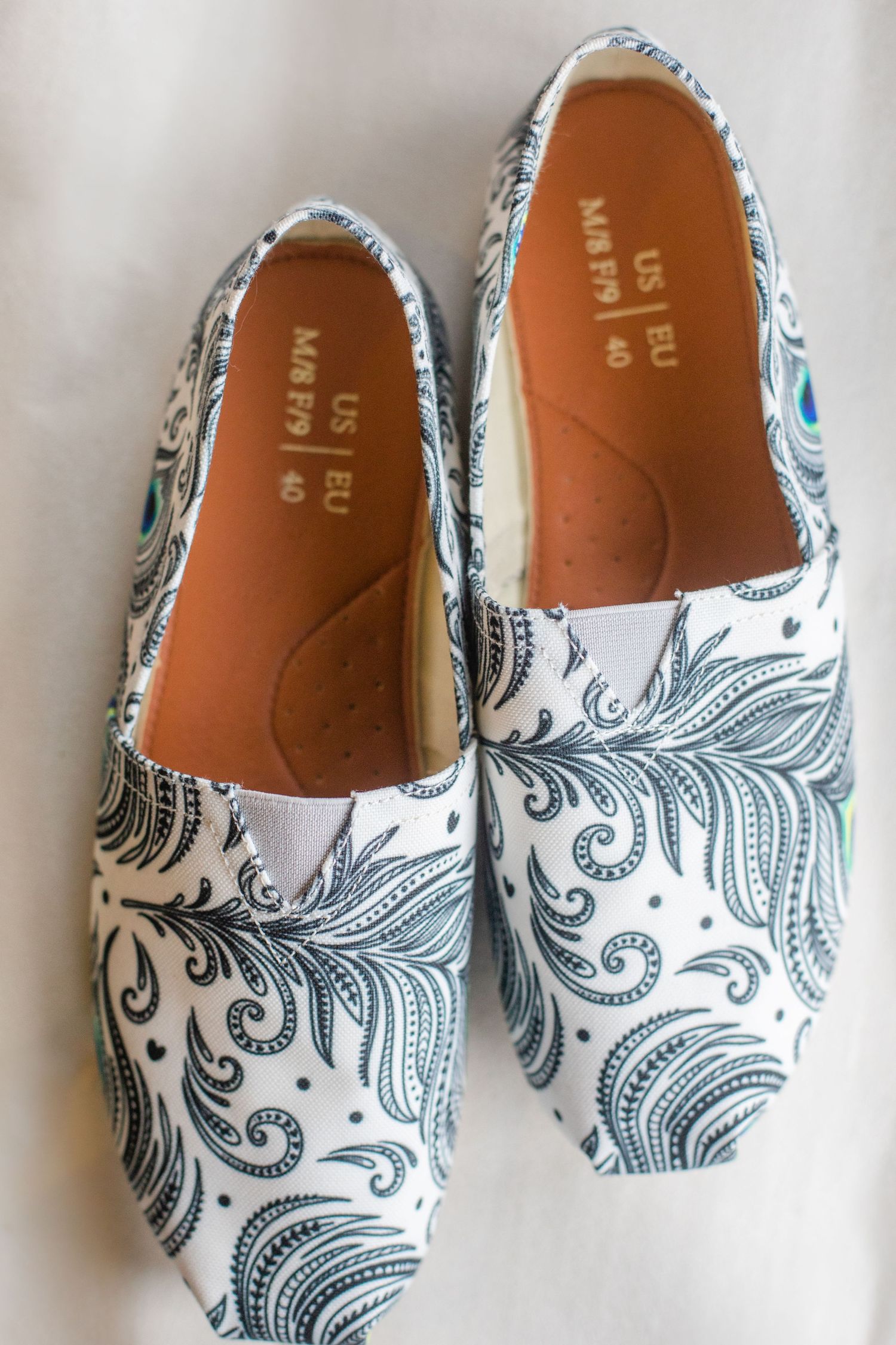 Wedding flats with elegant blue and white swirl pattern design.