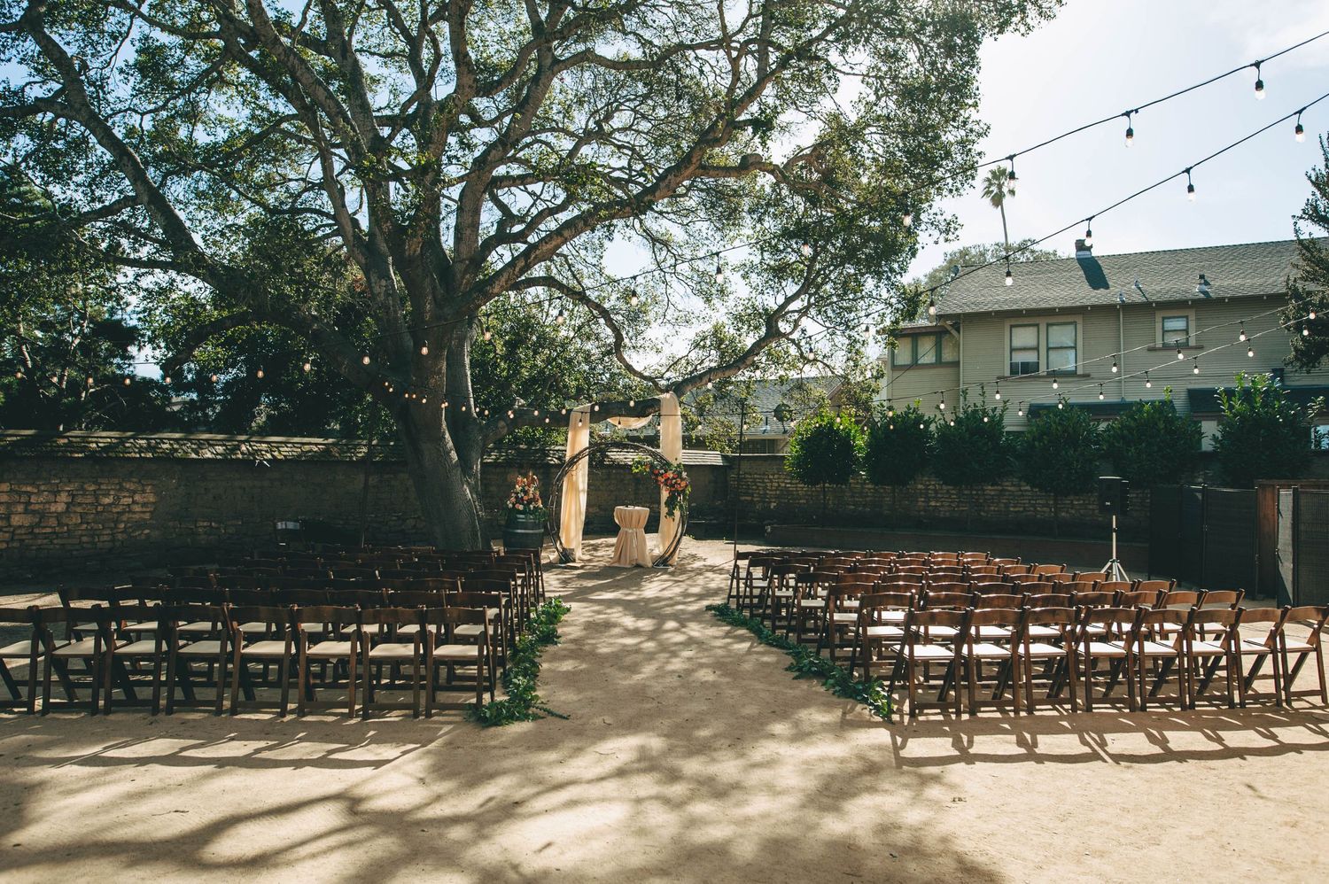 ceremony setup with circular arch at the barns at Cooper Molera in Monterey