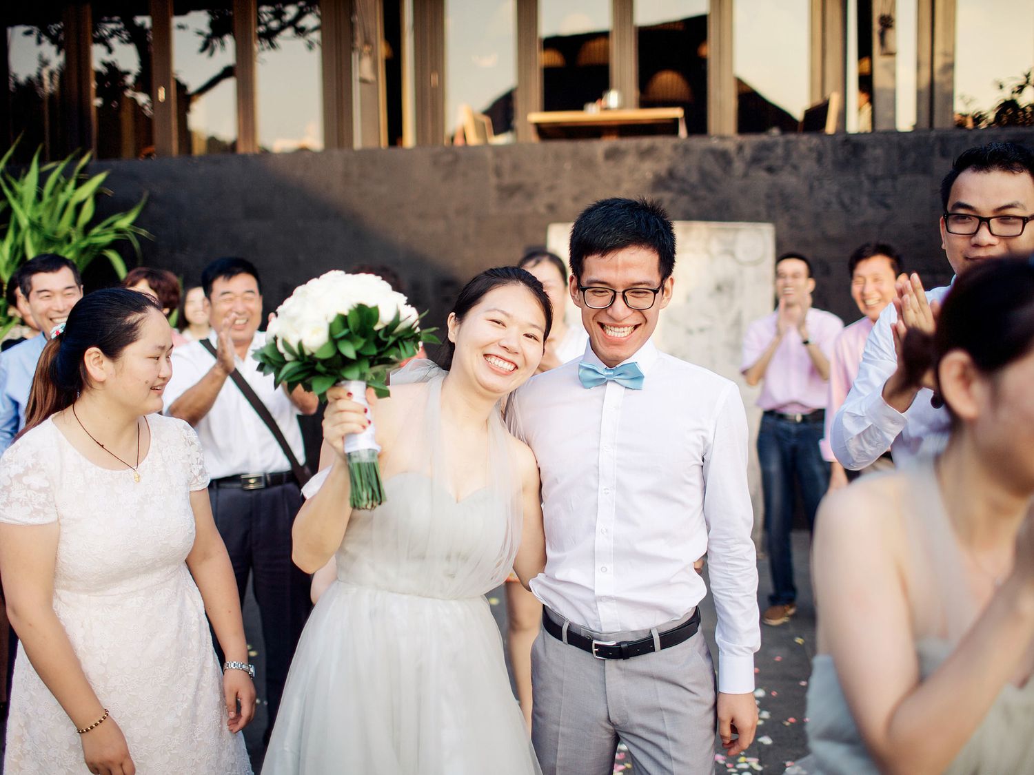 Wedding ceremony at Bulgari Resort Bali: A beautiful couple exchanging vows in a stunning beachfront setting.
