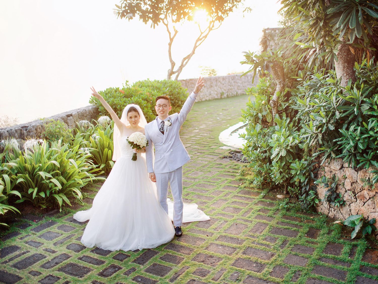 Happy couple celebrating their marriage at Bulgari Resort Bali.