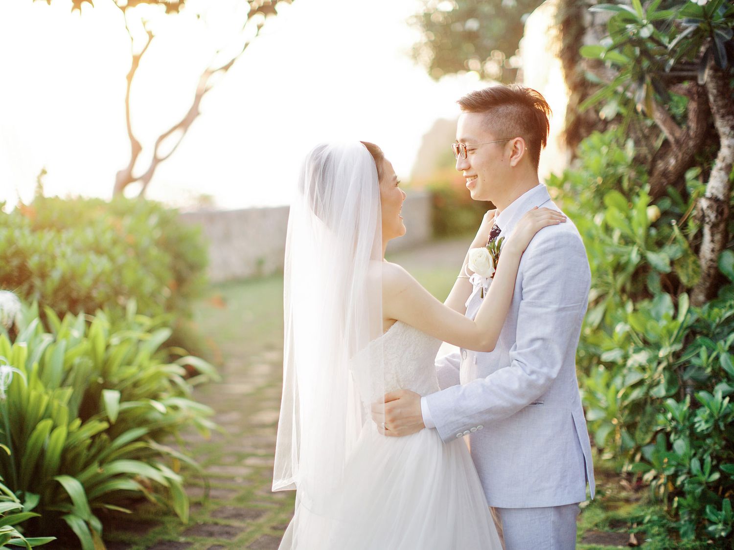 Bride and groom standing together at Bulgari Resort Bali.