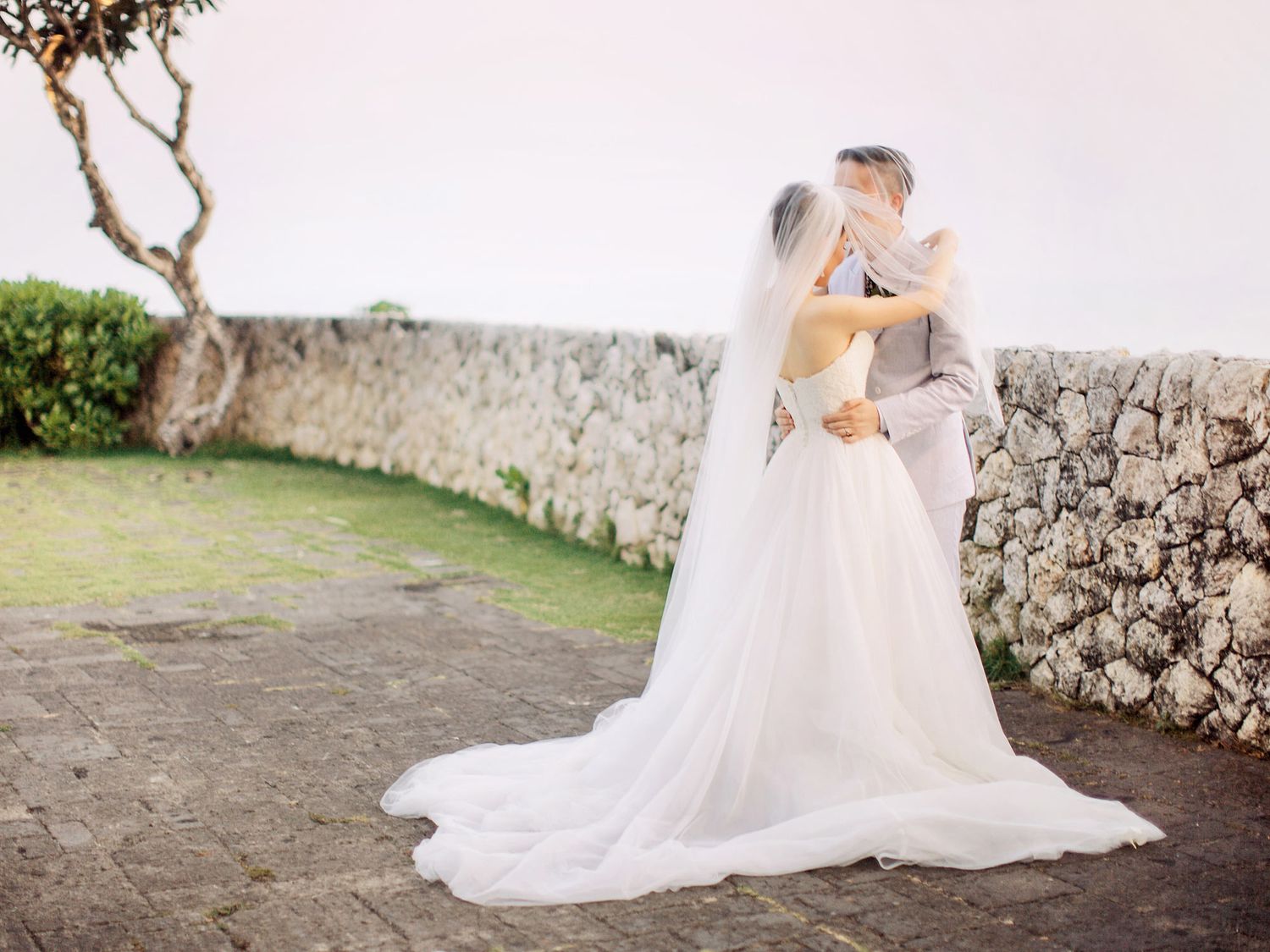A romantic Bali wedding photographer capturing bride and groom at Bulgari Resort Bali.