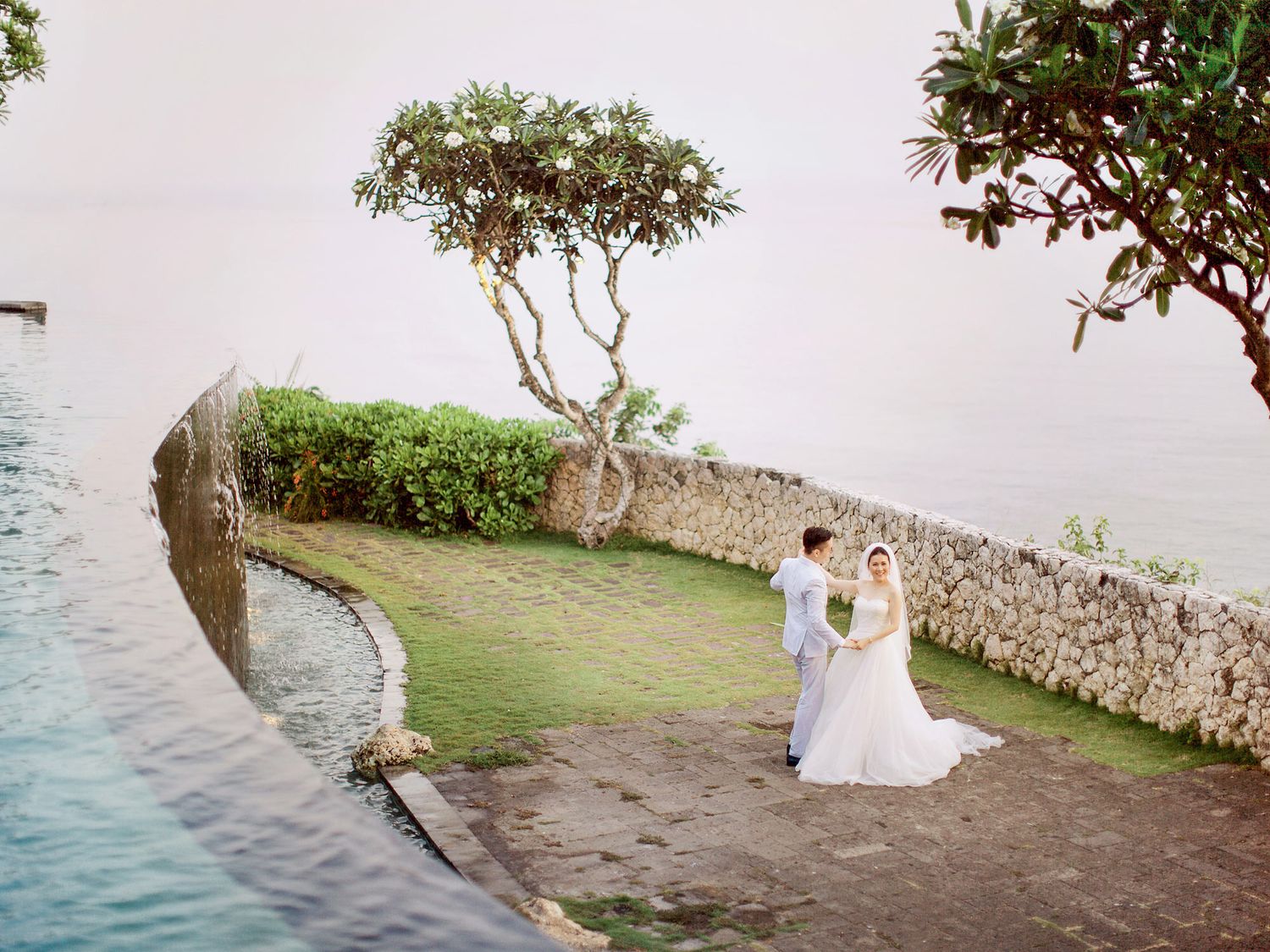 Bali wedding photographer captures bride and groom's romance at Bulgari Resort Bali.