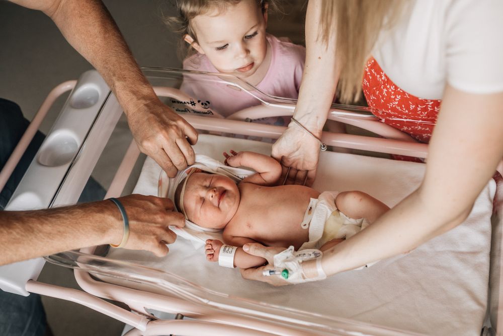 Dubai newborn photographer fresh 48 changing baby