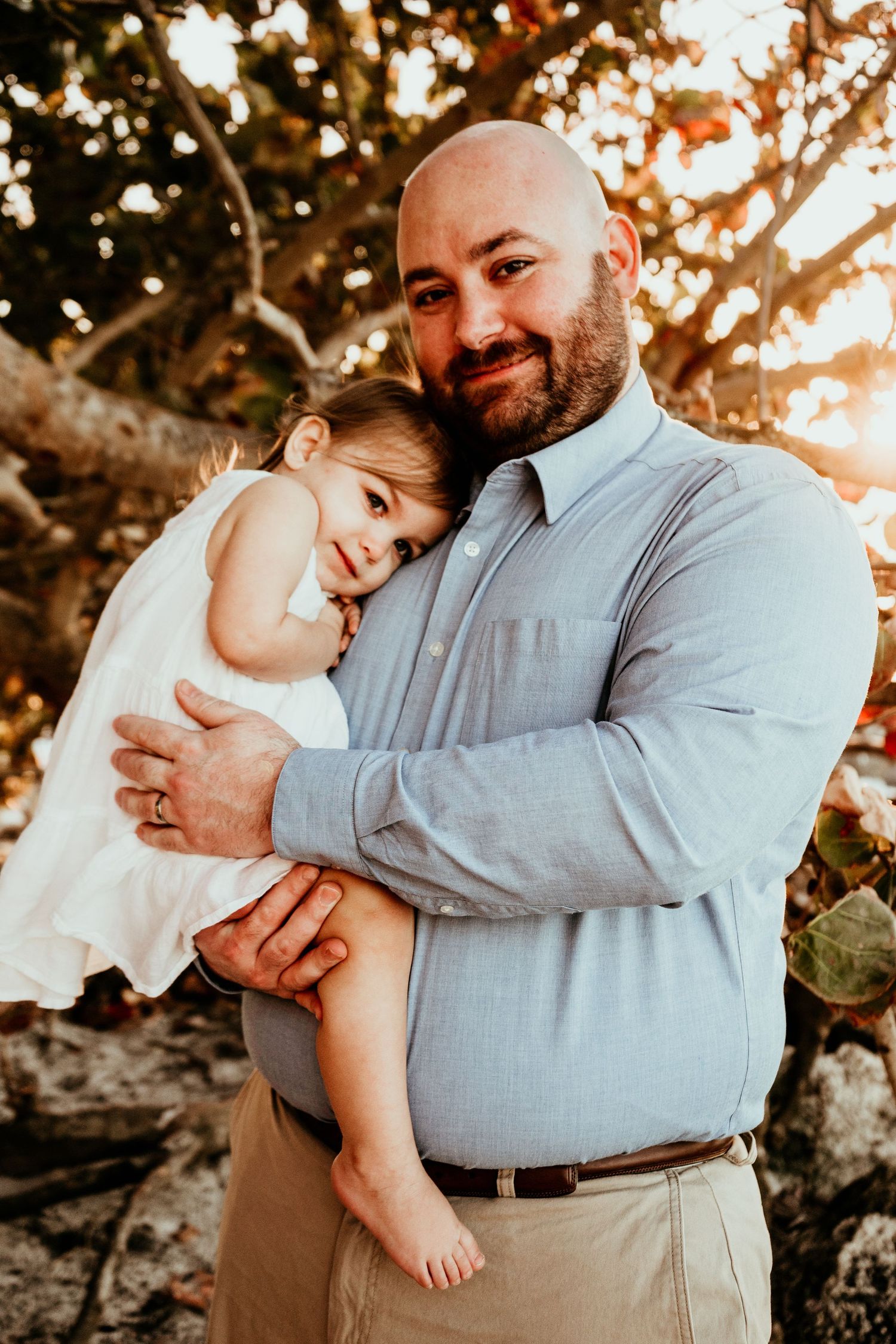 Outdoor Family Session Upham Beach, St. Pete, FL; Dad and daughter posing at sunset