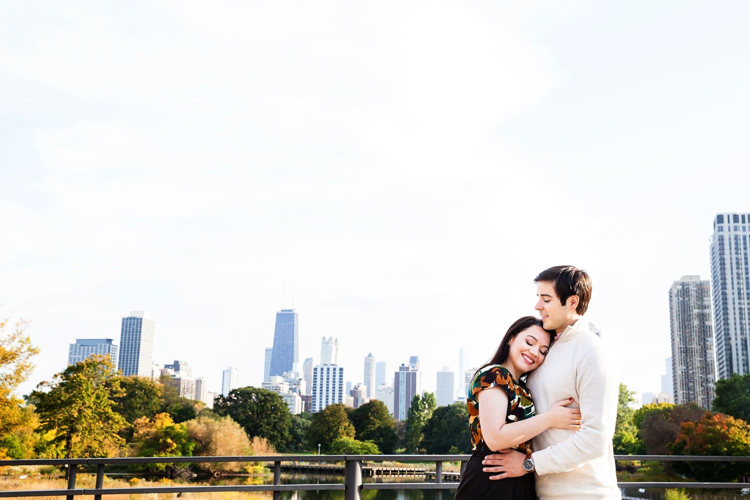 A romantic moment against Chicago's stunning skyline in warm autumn light.